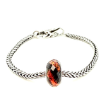 Volcanic Eruption Bead - by Trollbeads is designed by Bolli Ófeigsson goldsmith. Born from Fire - Inspired by Iceland’s volcanic power, this bead captures the beauty of flowing lava – a reminder of the island’s untamed energy and natural wonder. Available exclusively in Iceland. Ófeigur gullsmiðja, Skólavörðustíg 5. ofeigur.is