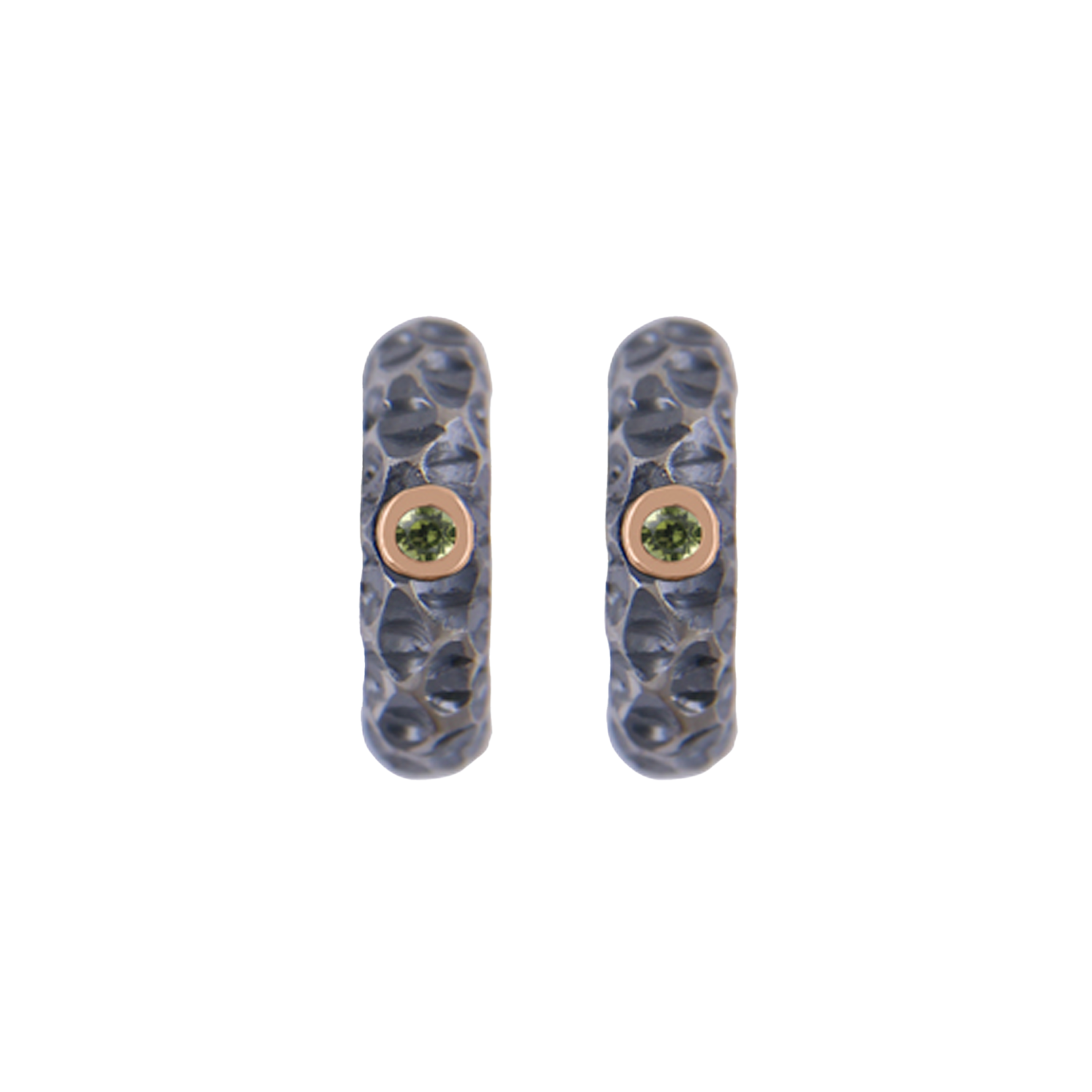 Experience the beauty of Icelandic lava with our LAVA - Titan Huggie earrings. Made of titanium and 9k Rose Gold with a stunning 2x1.5mm Peridot stone, these earrings feature a hand-engraved texture that is oxidized and polished to perfection. With dimensions of 15.5mm in height and 4mm in width, with an inner dimension of 7.5mm, these earrings offer a unique and elegant look that will enhance any outfit. Ófeigur gullsmiðja - ofeigur.is
