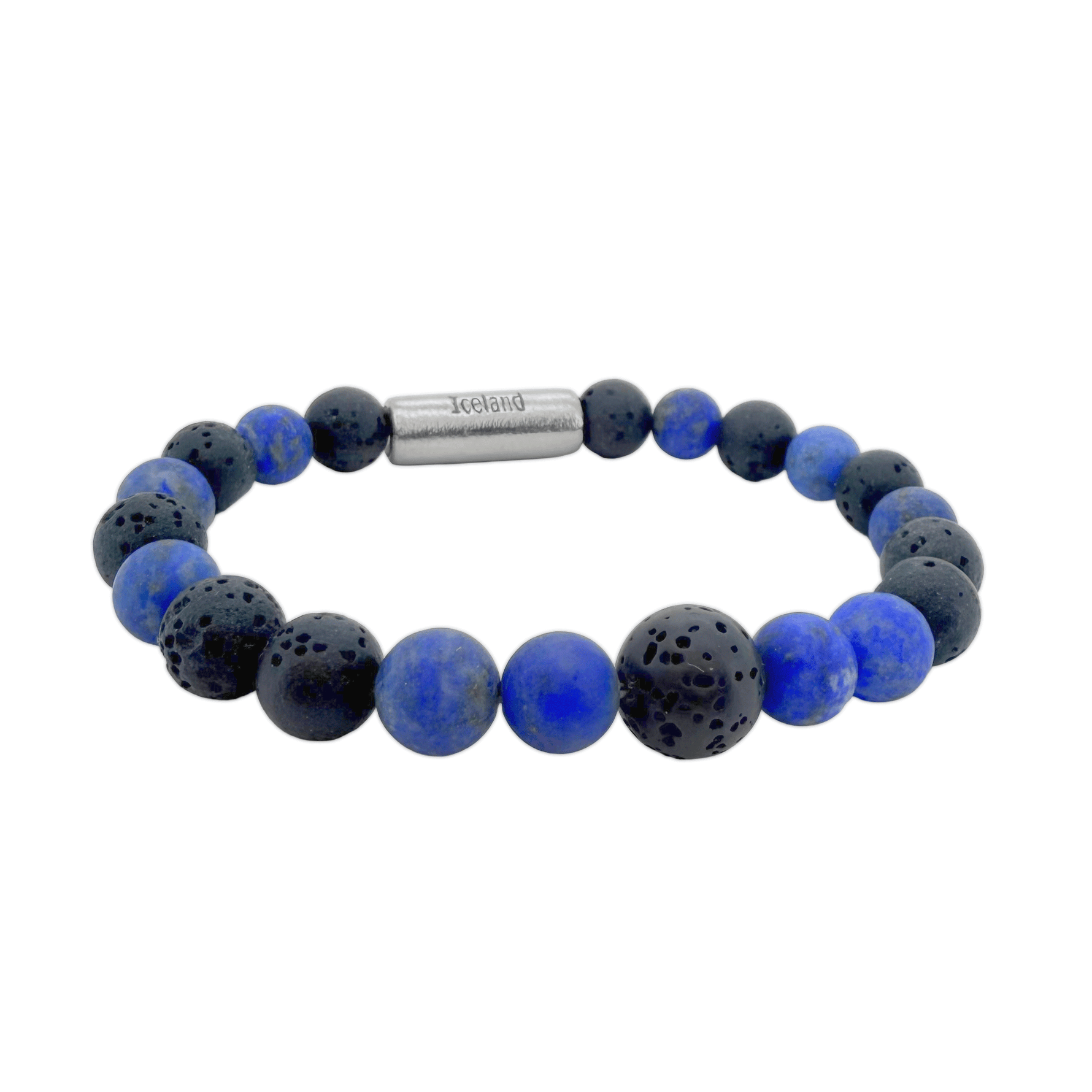A beaded stretch bracelet featuring alternating smooth royal blue lapis lazuli and porous black lava stone beads, completed with a titan magnetic clasp engraved with 'Iceland' and alongside the Raidho rune, an ancient symbol of safe travels and life's journey.