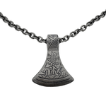A Viking axe pendant in titanium by Zeezen, featuring an oxidized finish and a rugged surface. It comes with a titanium chain with a rough, matte finish that complements the pendant’s raw, bold character.