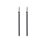 Dangling earrings by Zeezen, crafted from twisted titanium with a sandblasted, oxidized surface and naturally polished details for a distinctive finish.