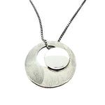 Solar Eclipse, silver pendant necklace, by Montoro, Ófeigur jewellery, Skólavörðustígur 5, 101 Reykjavík, Rainbow Street.