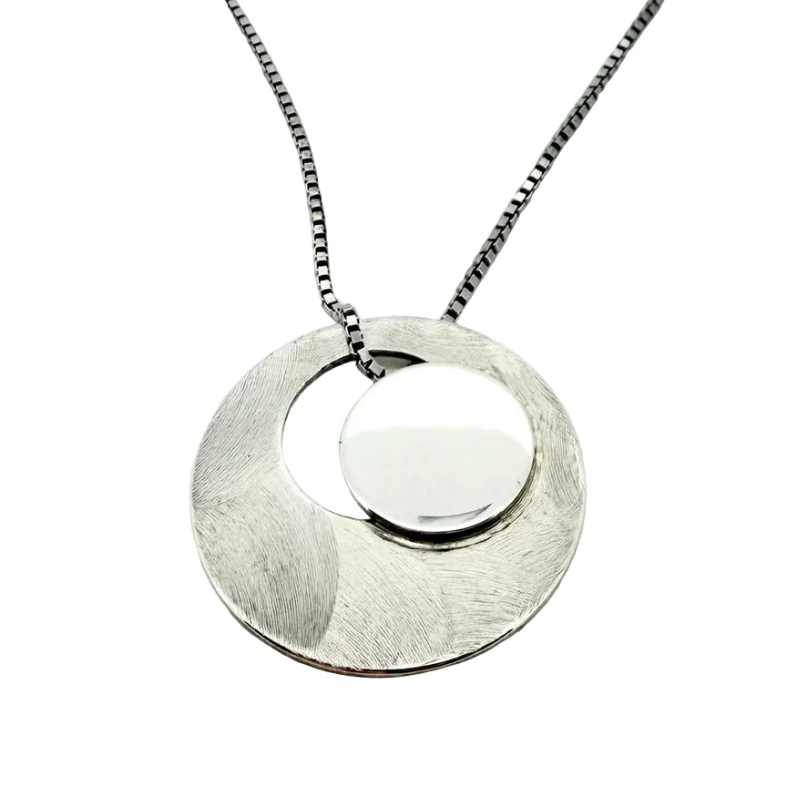 Solar Eclipse, silver pendant necklace, by Montoro, Ófeigur jewellery, Skólavörðustígur 5, 101 Reykjavík, Rainbow Street.