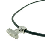 This titanium Thor's Hammer necklace in medium size boasts a sleek, matte finish and features a 3mm black leather leash with a titanium magnetic lock. With dimensions of L: 22 mm W: 18.5 mm H: 6.5 mm, you can choose leash length and color, this necklace is expertly crafted by Zeezen.